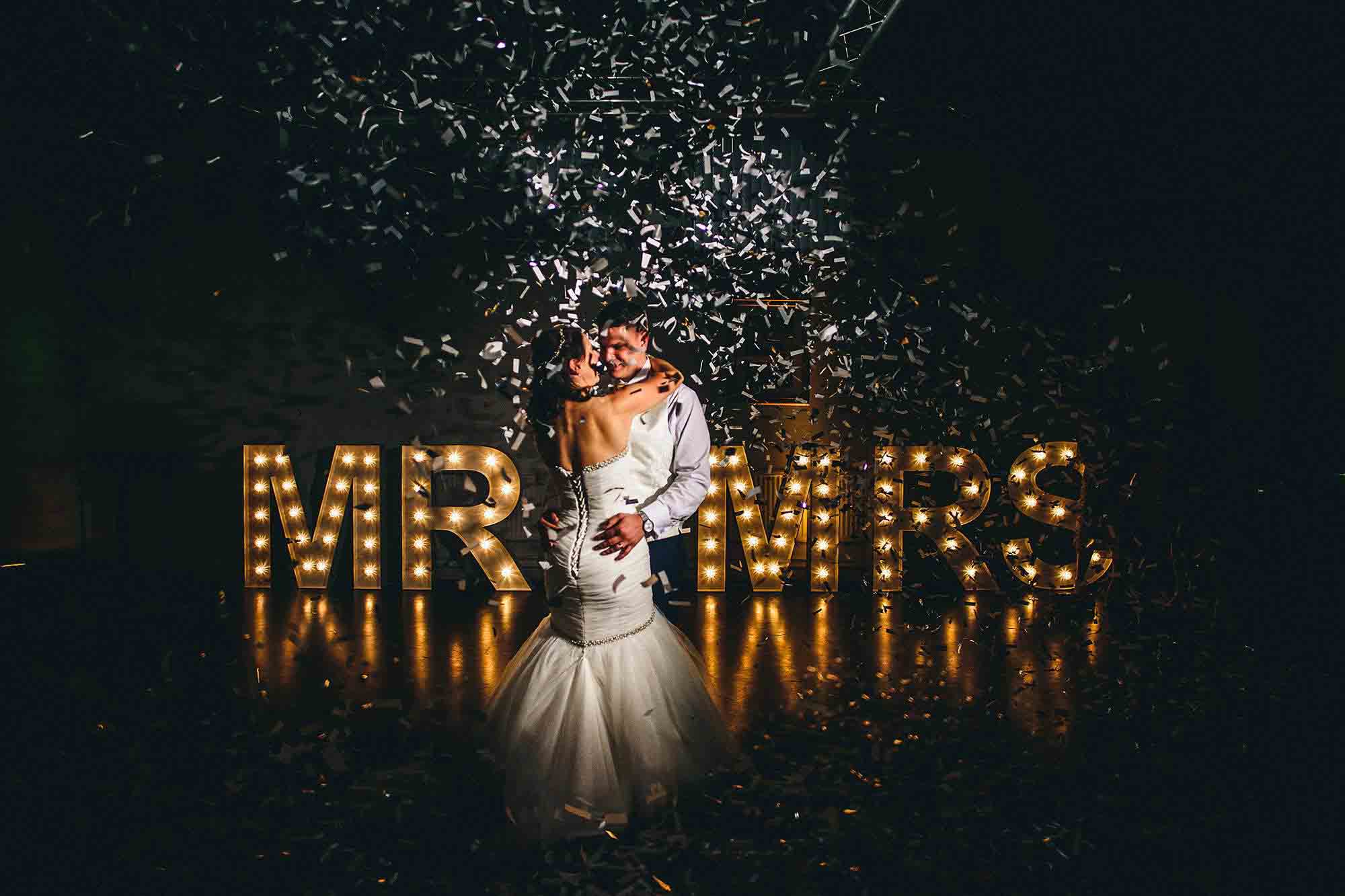 bride and groom dancing during confetti cannon
