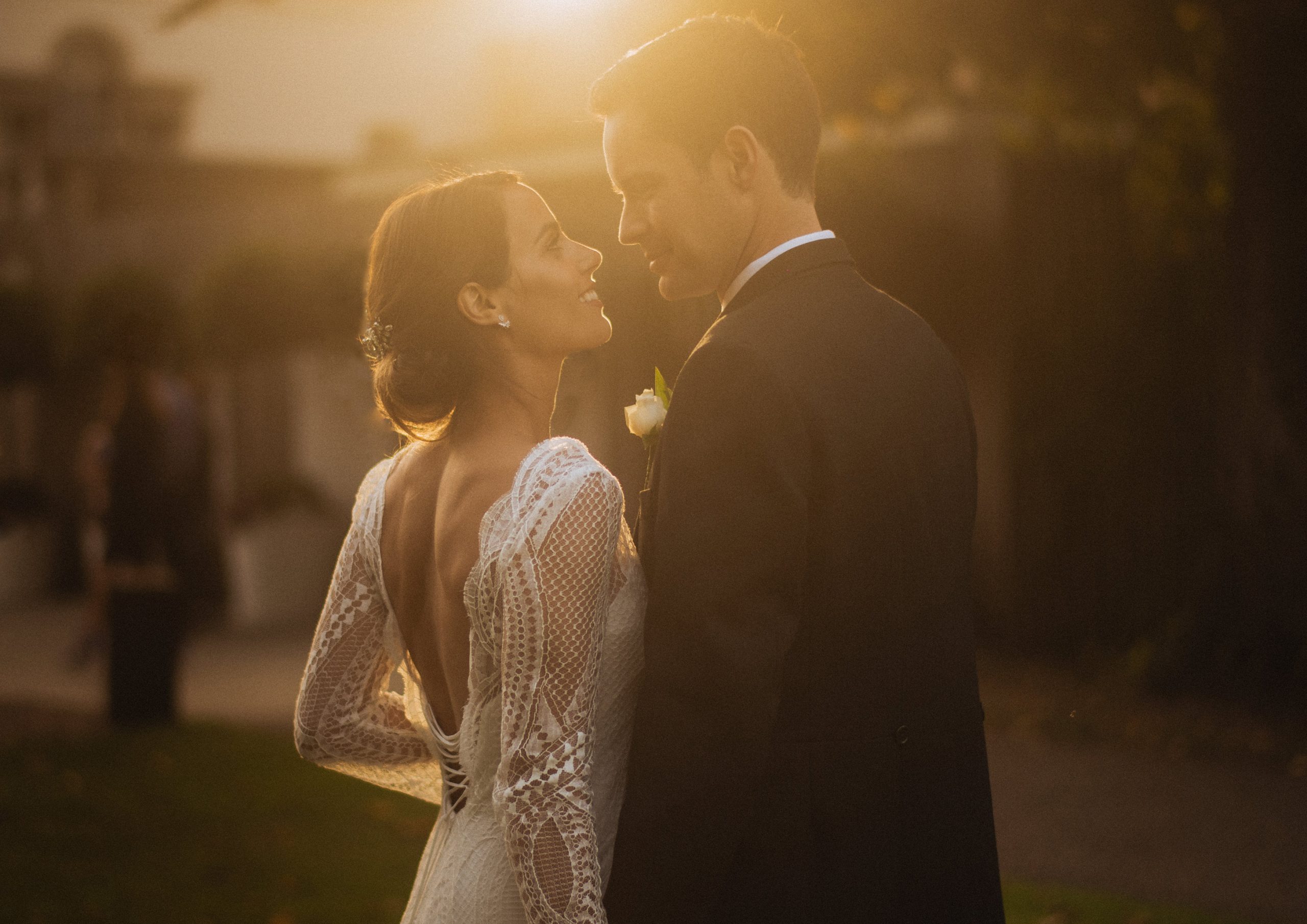 Beautiful sunset image of couple up close in lacy dress